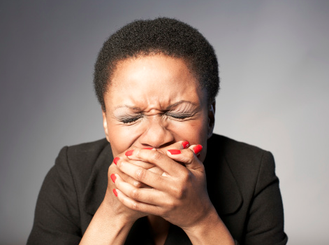 black-woman-holding-mouth